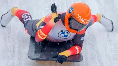 Germany's Tina Hermann reacts as she  finishes the fourth run of the women's skeleton competition of the IBSF Skeleton World Championship in Altenberg, eastern Germany, on February 12, 2021. (Photo by Odd ANDERSEN / AFP) (Photo by ODD ANDERSEN/AFP via G...